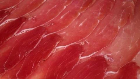 Serrano prosciutto dry cured ham red beef meat slices italian crudo cotto Stock Footage 98793763