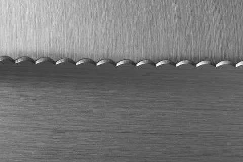Serrated Bread Kitchen Knife on brashed stainless background Stock Photos