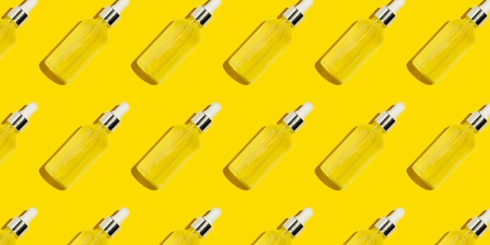 Serum bottle pattern on yellow background Stock Photos