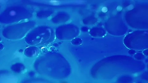 Serum bubbles oil fluid blue paint water droplets Video stock 281615229