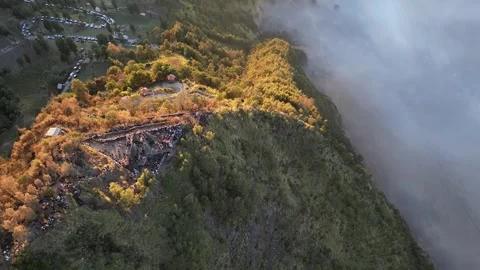 Seruni Point overlooking Mount Bromo volcano at sunrise, Java, Indonesia Stock Footage 253542327