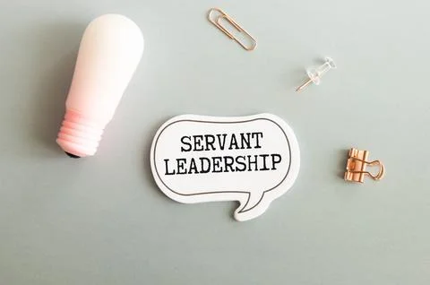 Servant Leadership write on paperwork isolated on Wooden Table Stock Photos