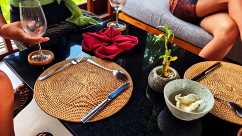Servant Serving Drinks at Elegant Restaurant Table, Kuta Selatan, Bali Stock Footage 313854685