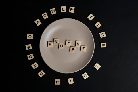 To serve a protest concept. Word protest on a dish Stock Photos