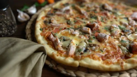 Served appetizing pizza on the table Stock Footage 87870769