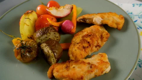 Served baked cooked vegetables with chicken meat slices on plate, close-up view. Stock Footage 312464657