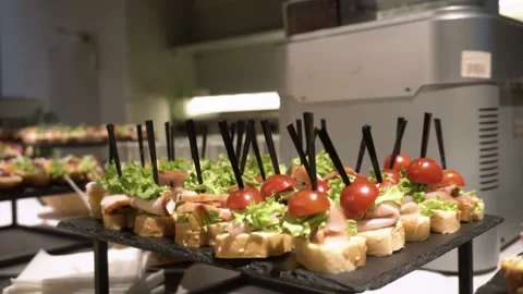 Served banquet table with various appetizers and refreshments at the corporate Stock Footage 230107228