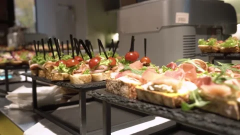 Served banquet table with various appetizers and refreshments at the corporate Stock Footage 231003353