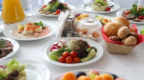 Served for a banquet table. Wine glasses with napkins, glasses and salads Stock Footage 53010686