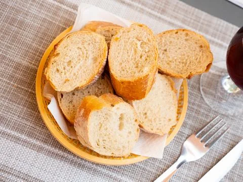 Served bread in wicker plate 스톡 사진