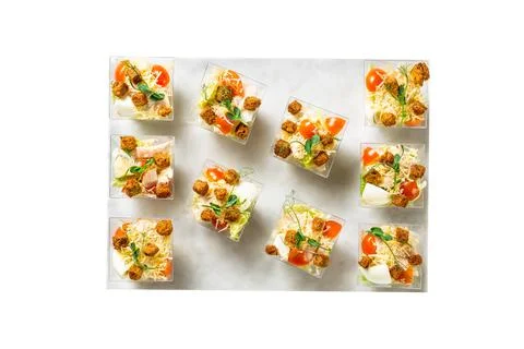 Served Caesar salad in a plastic boxes, catering food Stock Photos