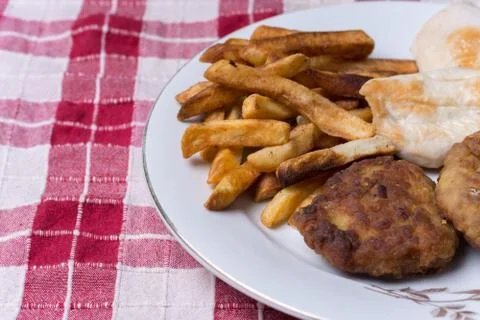 Served chichen meat beef meatballs and french fries Stock Photos