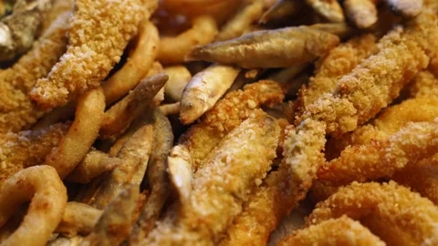 Served deep fried fish mix food set composition. Cook made squid rings, sprat Stock Footage 158853685