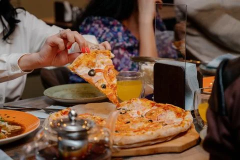 The served dinner table with pizza Stock Photos