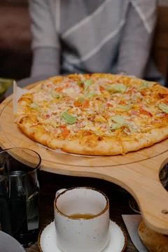The served dinner table with pizza Stock Photos
