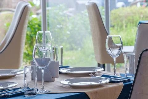 Served dinner table in a restaurant. Restaurant interior 写真素材