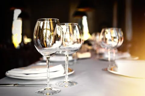 Served dinner table set in a luxury restaurant. Restaurant interior with window Stock Photos