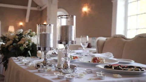 Served dishes and candles on the table at the wedding Banquet Stock Footage 131009717