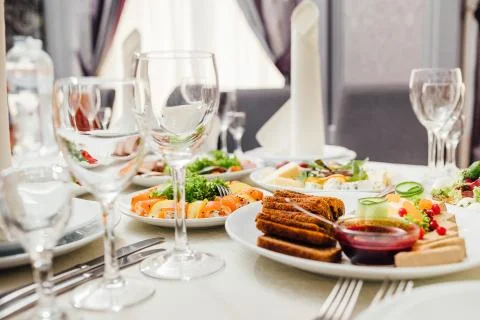 Served dishes to the table for holiday. Stock Photos