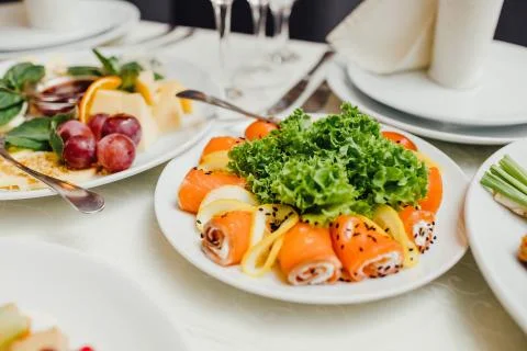 Served dishes to the table for holiday. Stock Photos