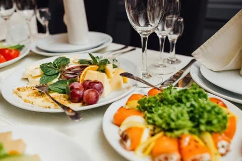 Served dishes to the table for holiday. Stock Photos