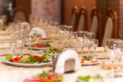 Served festive table with snacks, glasses, glasses, cutlery and napkins for a Stock Photos