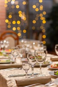 Served festive table with snacks, glasses, glasses, cutlery and napkins for.. Фото