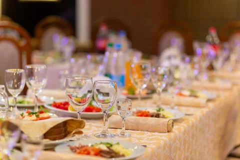 Served festive table with snacks, glasses, glasses, cutlery and napkins for.. Fotos de archivo