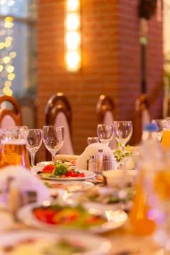 Served festive table with snacks, glasses, glasses, cutlery and napkins for.. Фото