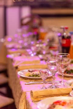 Served festive table with snacks, glasses, glasses, cutlery and napkins for.. Фото