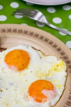 Served fried eggs for breakfast Stock Photos
