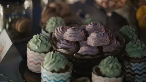 Served holiday table with sweet table with marshmallows in the evening. Video stock 93288813