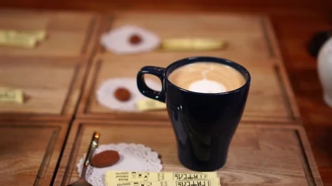 Served latte cups with coffee art ornaments made with milk in cappuccino cups Stock Footage 103992925