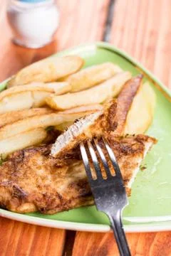 Served lunch with fried chicken breasts in eggs with french fries Foto stock