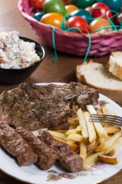 Served lunch on the table with meat and Easter eggs Stock Photos