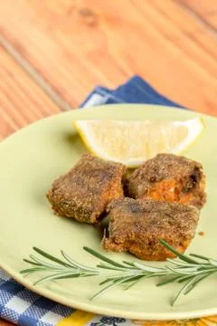 Served meal with fried hake fish with lemon and rosemary Stock Photos