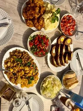 Served Meals on a Dining Table Arrangement 写真素材
