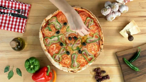 Served pizza, decorated with basil, top view, female hands Video stock 50369643