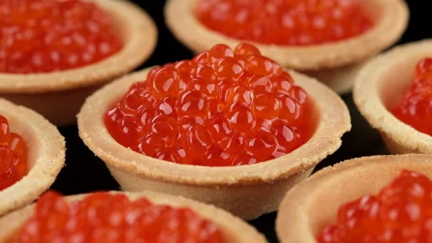 Served red caviar. Tartlets with red caviar close-up, rotation Video stock 167251087