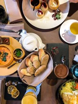 Served restaurant table with different dishes, salad, soup, bread, curd pancakes Stock-Fotos