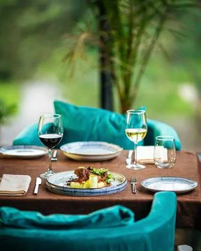 Served restaurant table with drinks and food Stock Photos