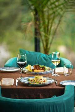 Served restaurant table with drinks and food Stock Photos