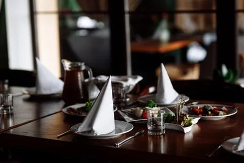 Served restaurant table. selective focus. noise is present. Stock Photos