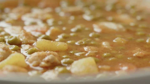 Served stew made of peas and poultry 4K video Video stock 172382869