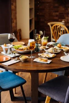 Served table with alcohol drinks and dishes Stock Photos