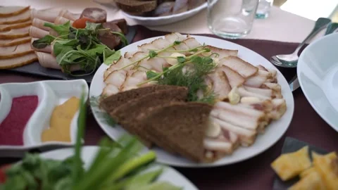 Served table with cheese and cold cuts. Slow motion Видео 248389671