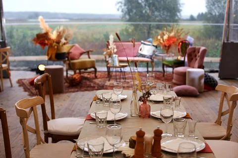 Served table with decor on empty terrace in restaurant Stock Photos
