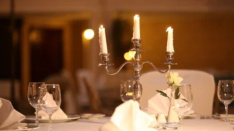 Served table with dishes and candles in a restaurant Stock Footage 121273510