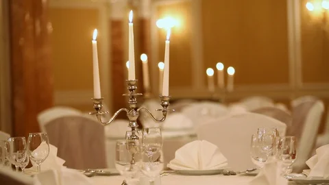 Served table with dishes and candles in a restaurant Stock Footage 121285599