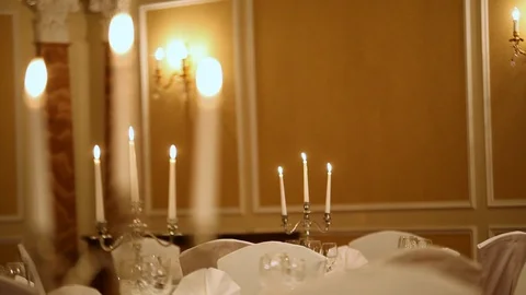 Served table with dishes and candles in a restaurant Stock Footage 121286062